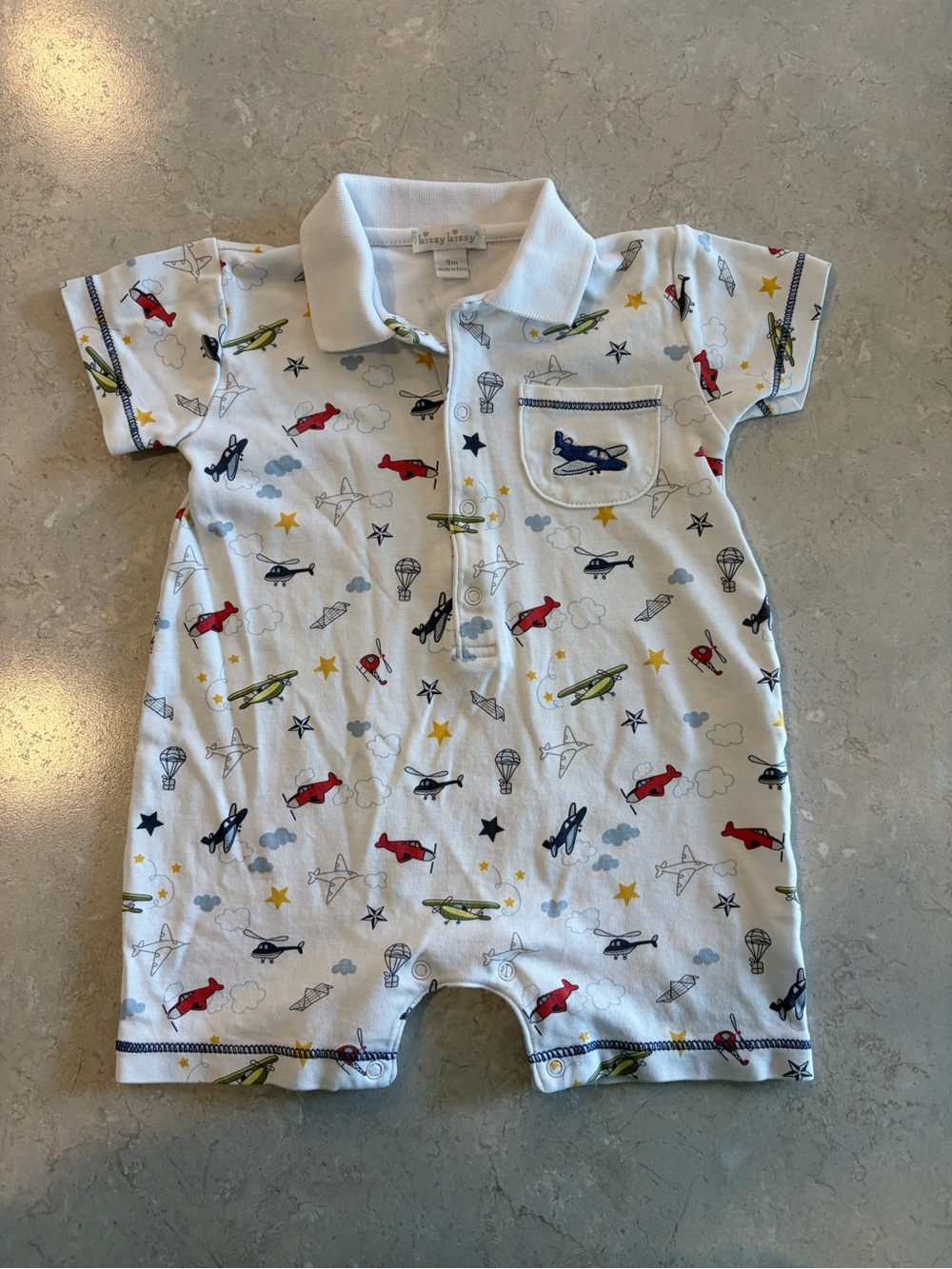 Kissy Kissy White Polo Romper with Red, Blue & Green Planes